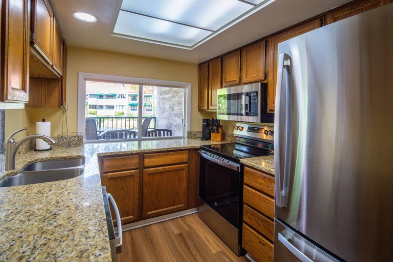 When you enter the villa, you will find the clean, spacious kitchen.