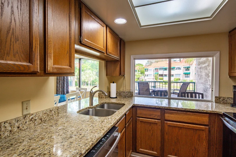 The kitchen features a dishwasher and ample counter space for preparing your meals.