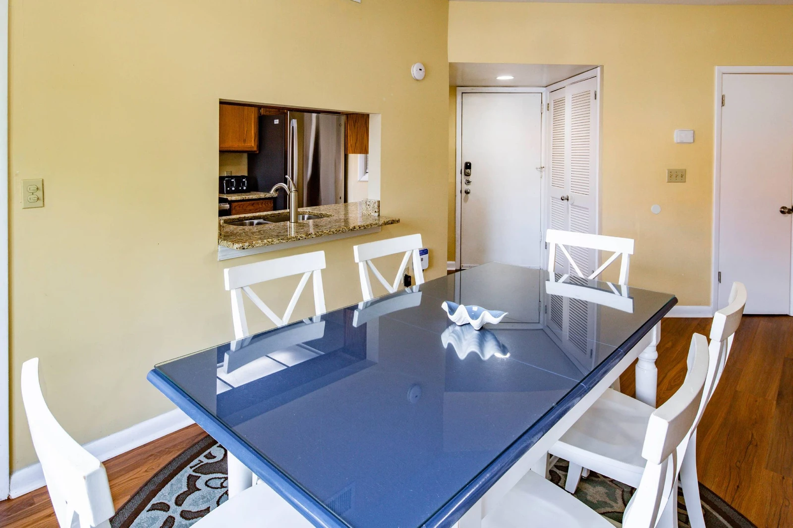 The dining table comfortably seats 6.