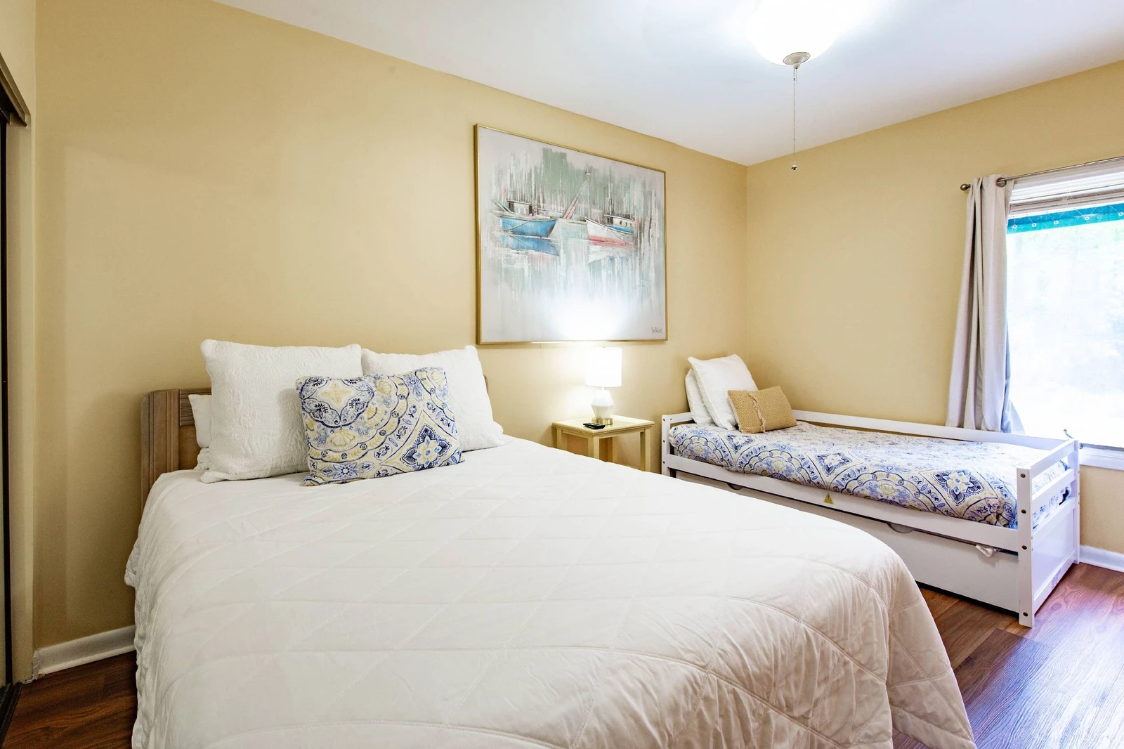 The guest suite features a queen bed, twin day bed and a twin trundle bed.