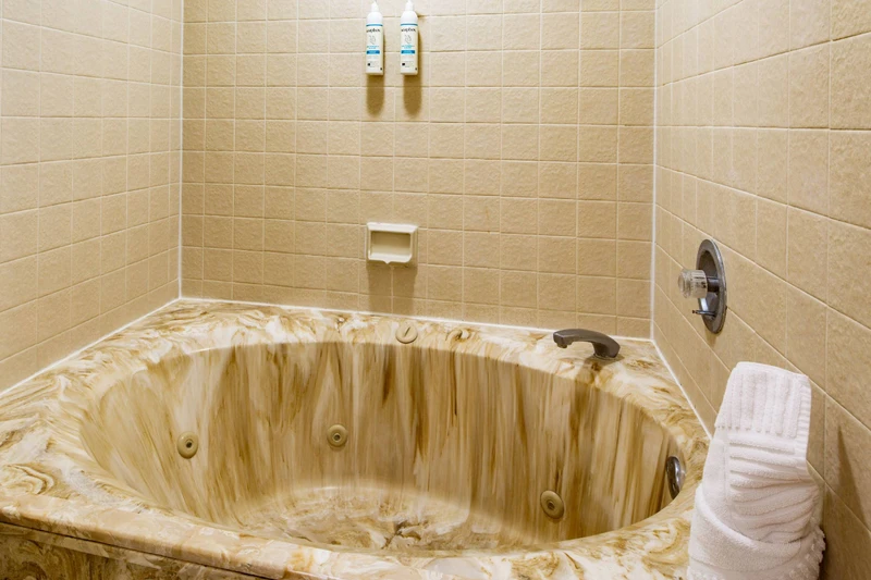 The en suite bathroom also has a shower/tub combo.