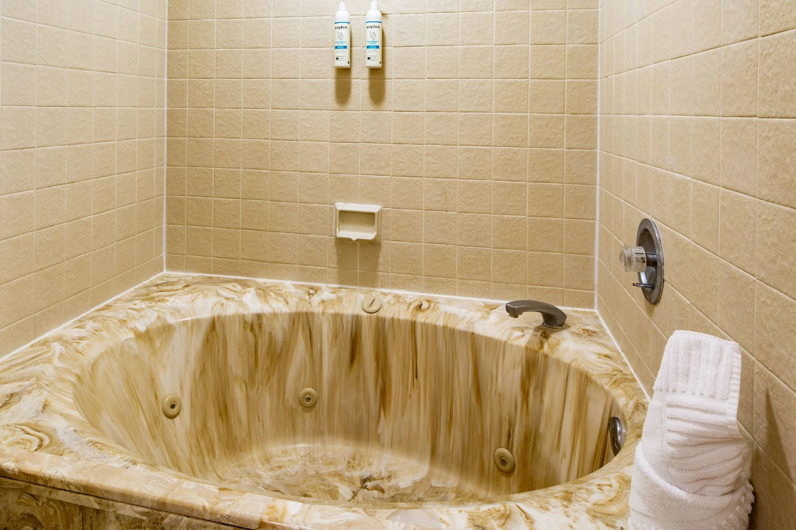 The en suite bathroom also has a shower/tub combo.