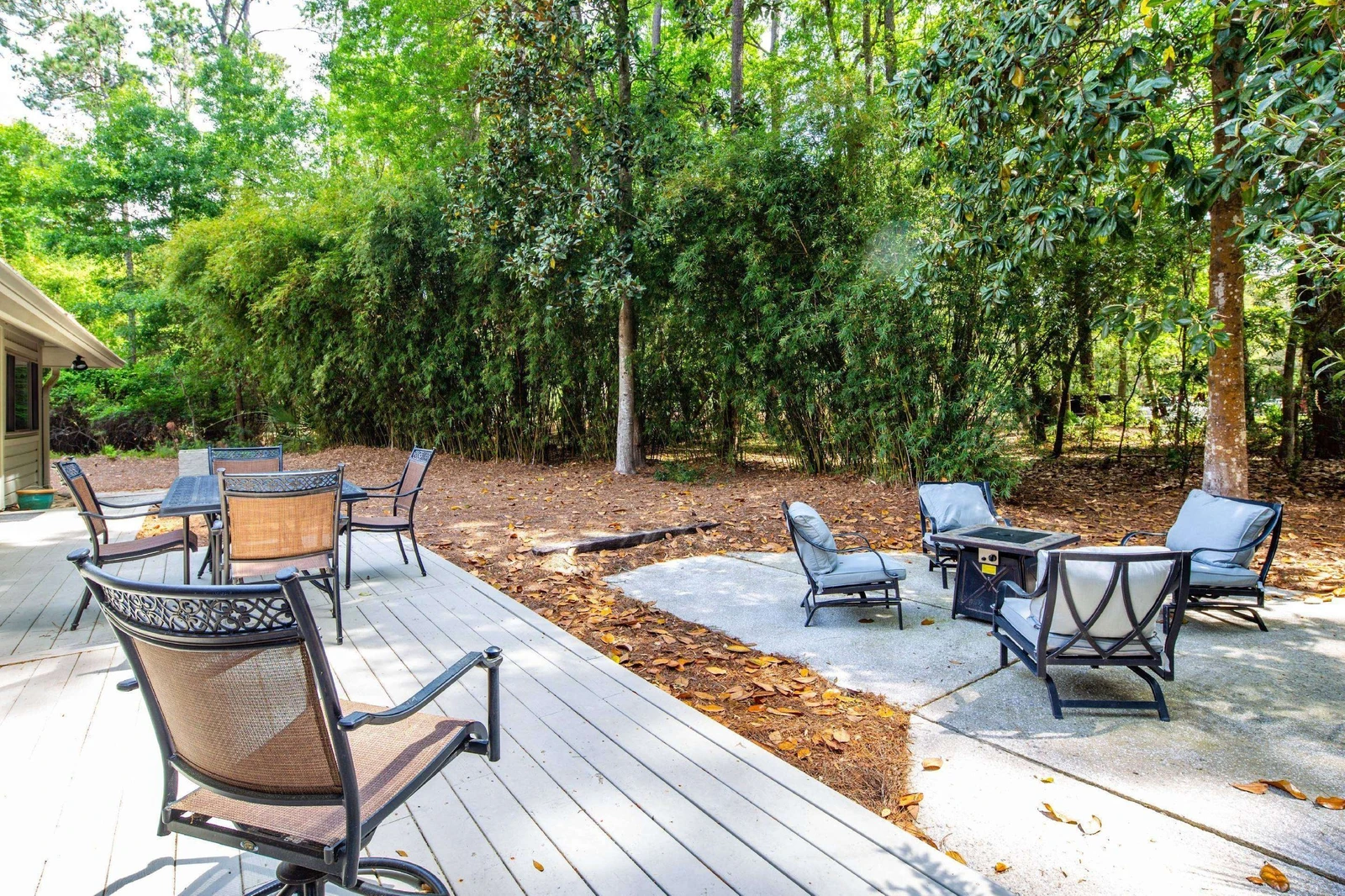 The back deck steps down to a lower level patio.