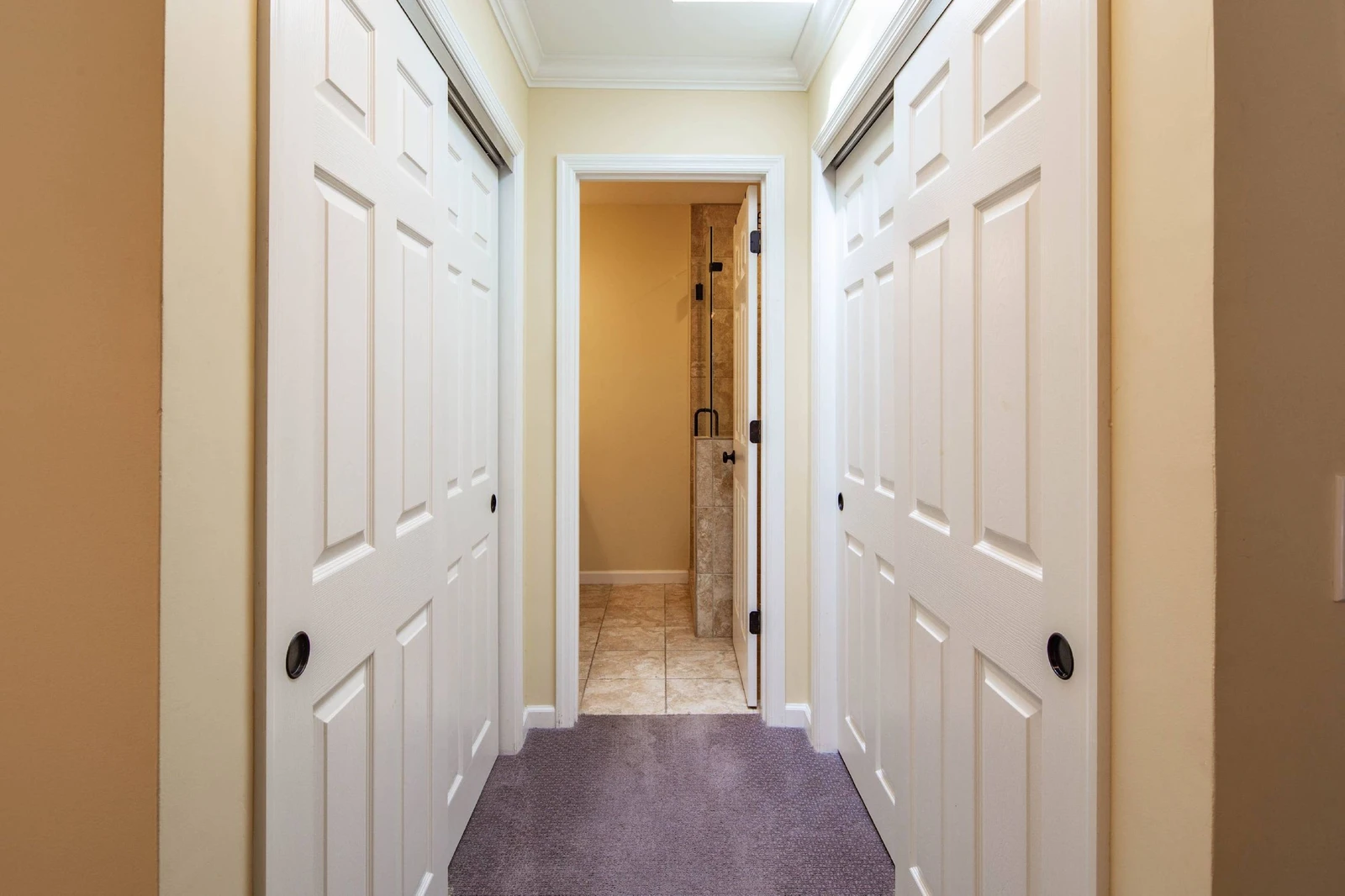 There are two closets in the nook that leads to the primary en suite bathroom.