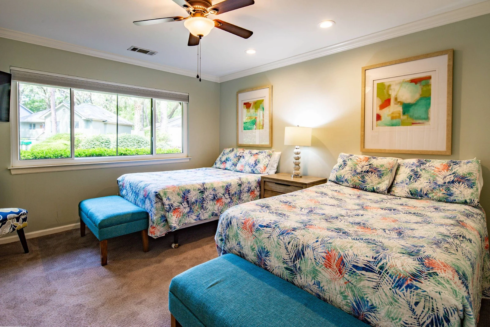 The full suite features two full beds and two benches at the foot of each bed.