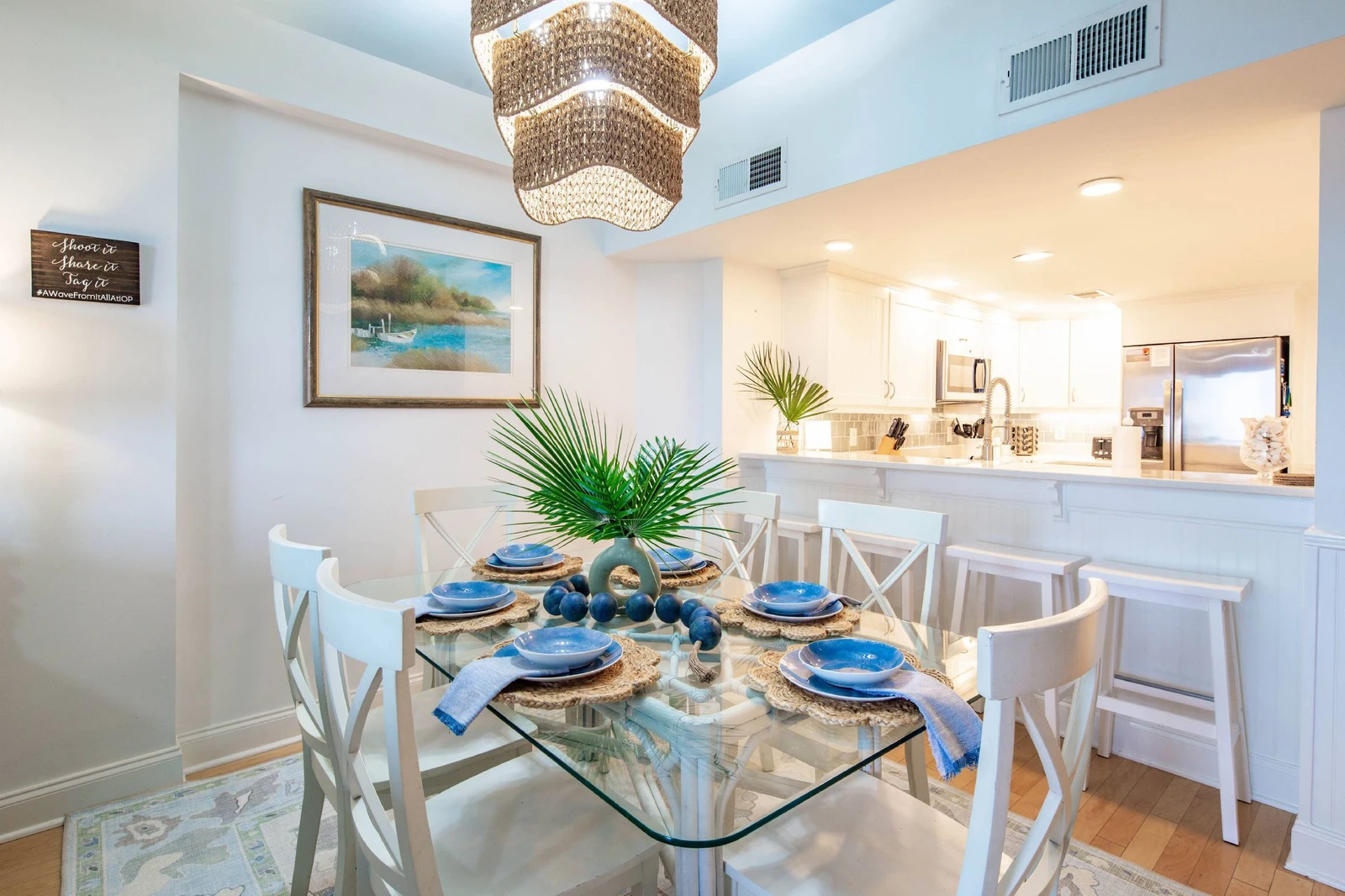 The dining table seats 6 and there are 4 stools at the kitchen counter.