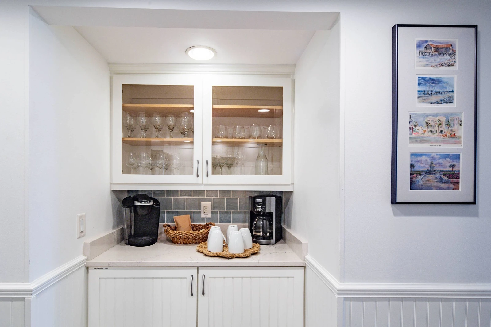 There is a coffee bar and additional cabinets & storage area on the other side of the kitchen.
