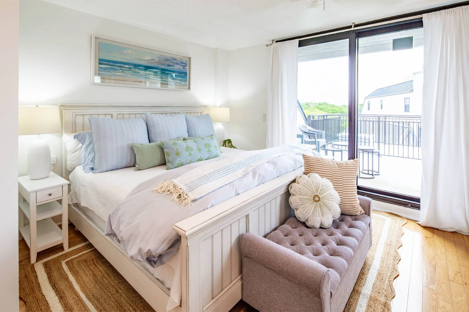 The guest suite features a king bed and access to a private balcony.