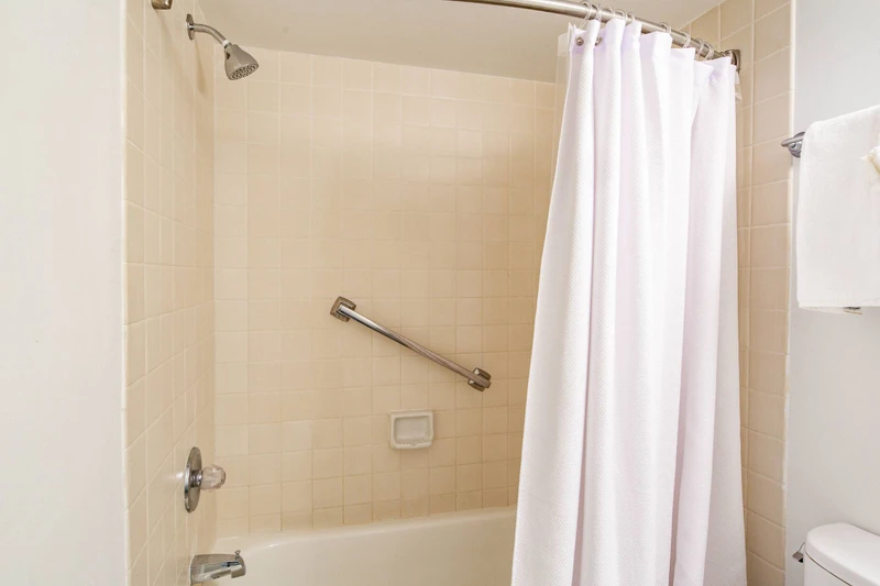The en suite bathroom also features a shower/tub combo.