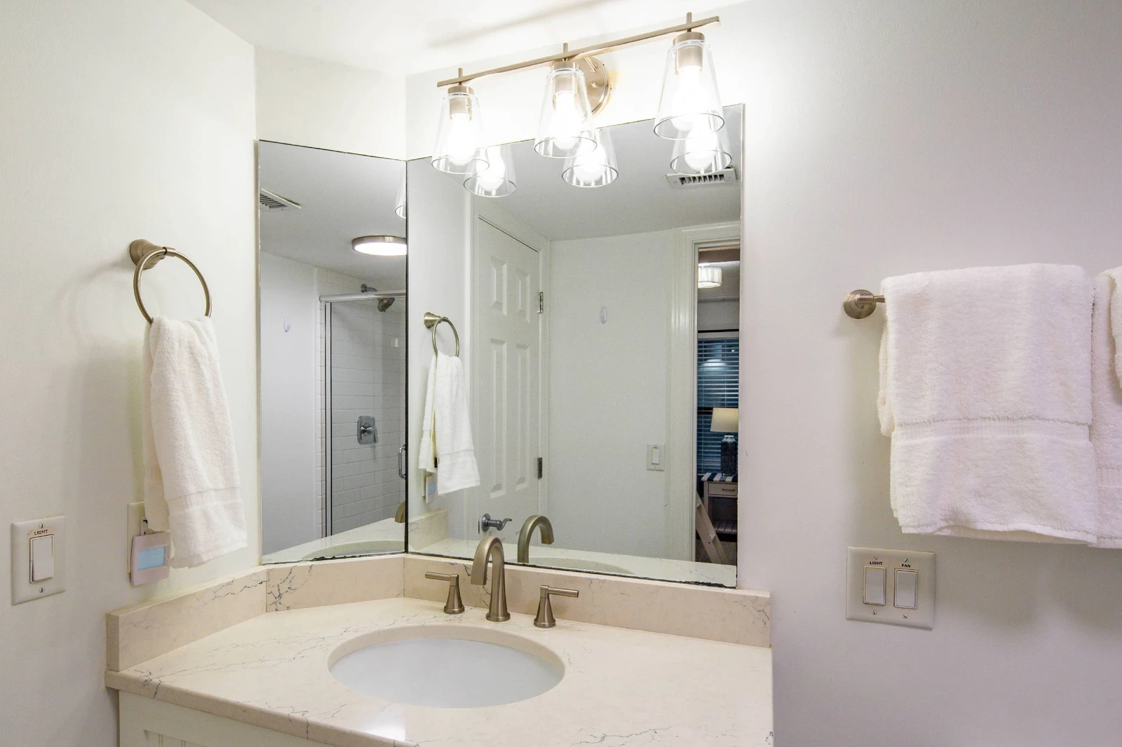 The hallway bathroom (which is also accessible via the guest bedroom) features a vanity.