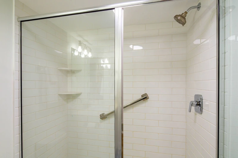 The hallway bathroom (which is also accessible via the guest bedroom) features a tiled, walk-in shower.