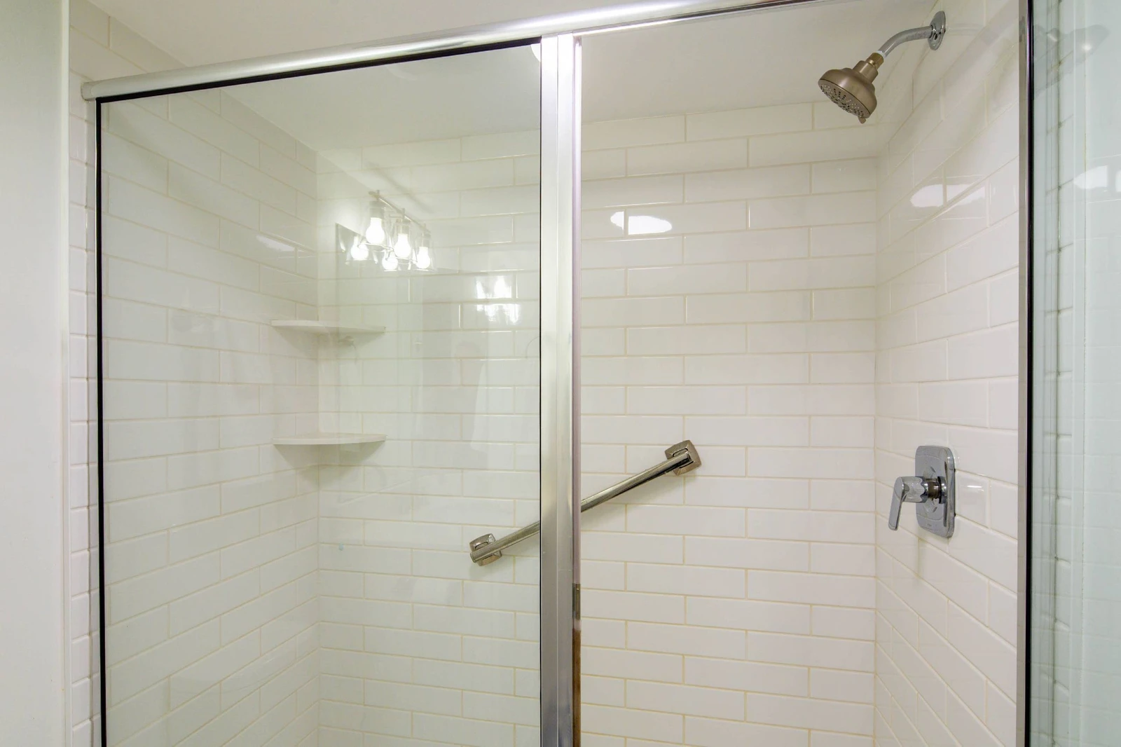 The hallway bathroom (which is also accessible via the guest bedroom) features a tiled, walk-in shower.