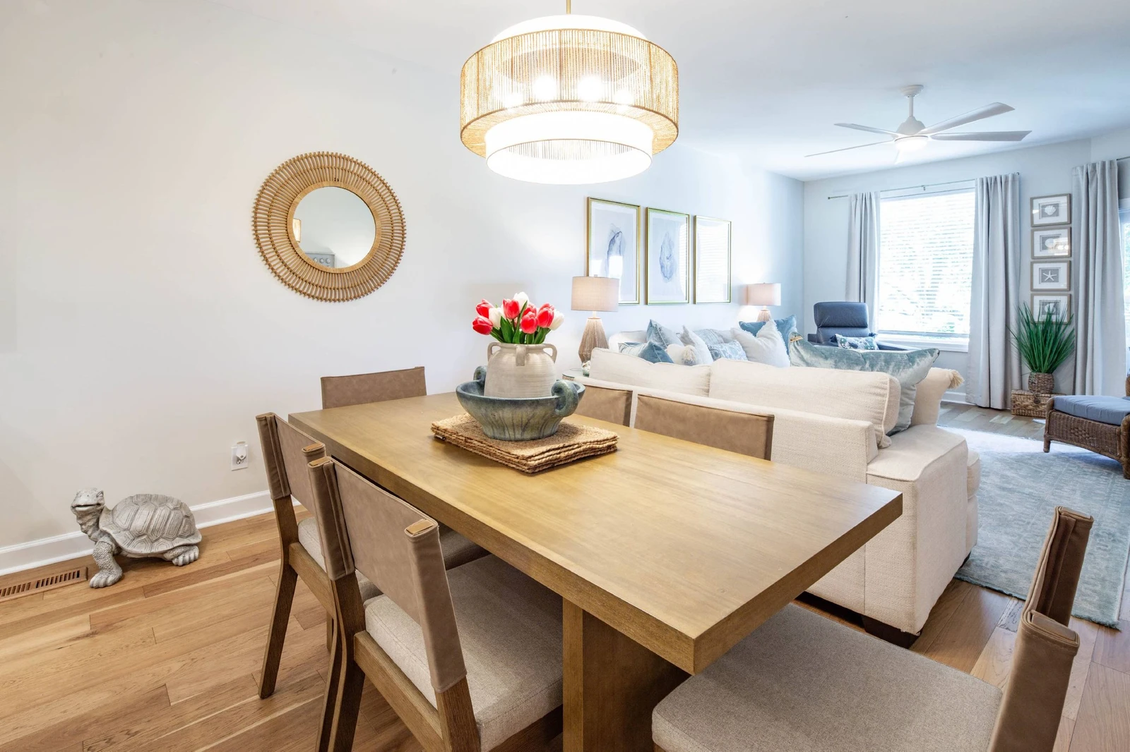 The dining table comfortably seats 6.  There are additional stools at the kitchen island.