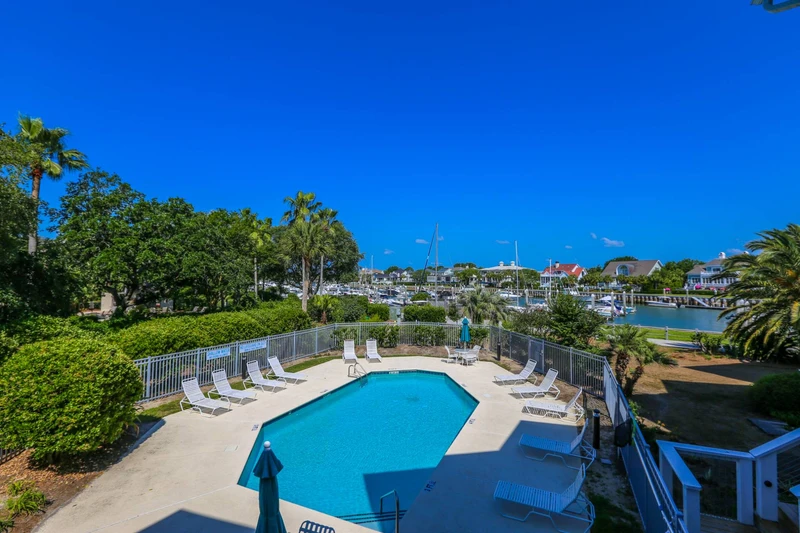 The community pool looks out onto the marina behind The Moorings community.