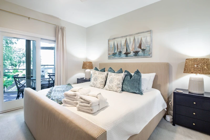 The primary suite also features sliding door access to the screened porch.