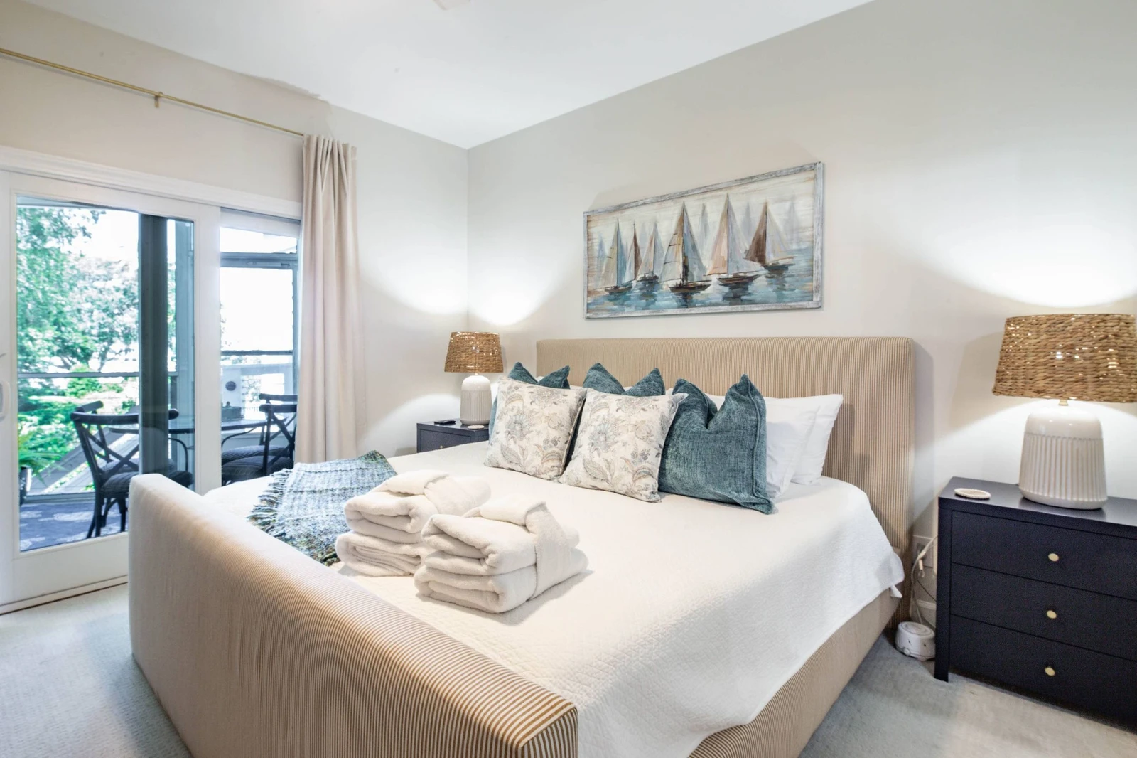 The primary suite also features sliding door access to the screened porch.