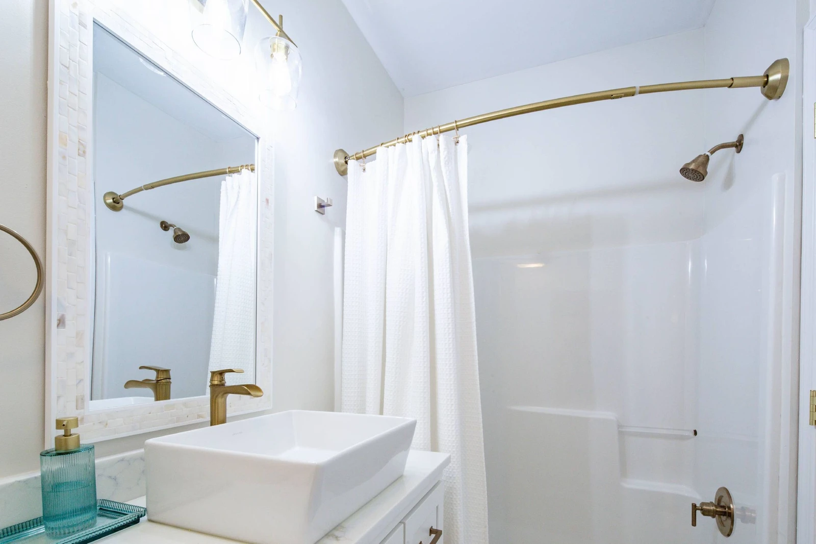 The hallway bathroom features a vanity and a shower/tub combo.