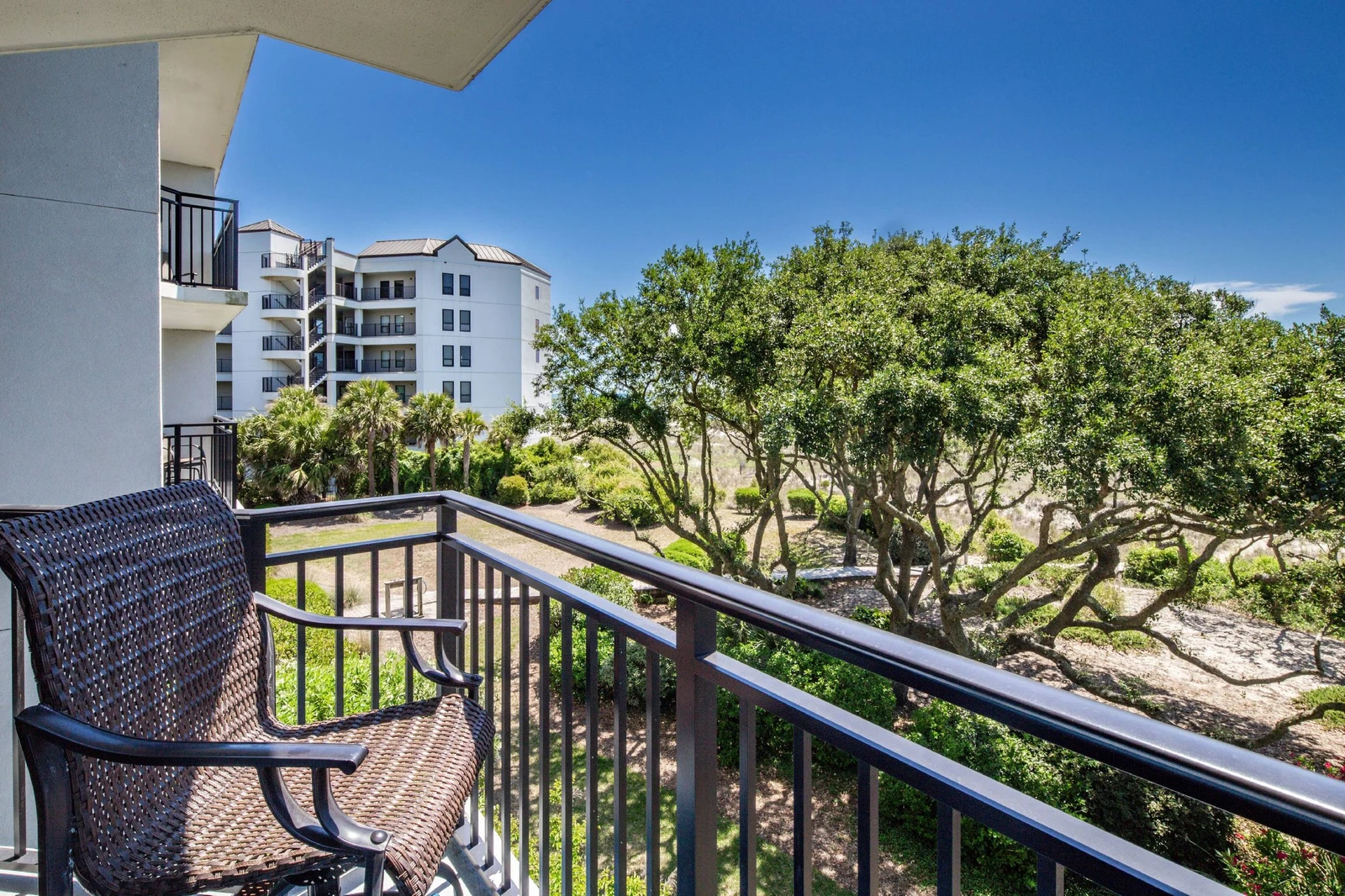 The partially covered balcony also has views of one of the Shipwatch boardwalks and the landscaping below.