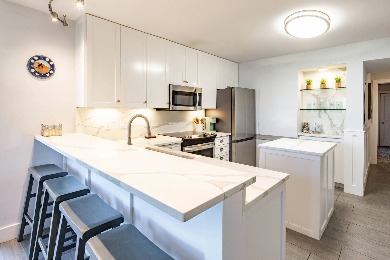 There are 4 stools at the kitchen counter.