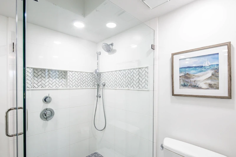 The walk-in shower features two shower heads.