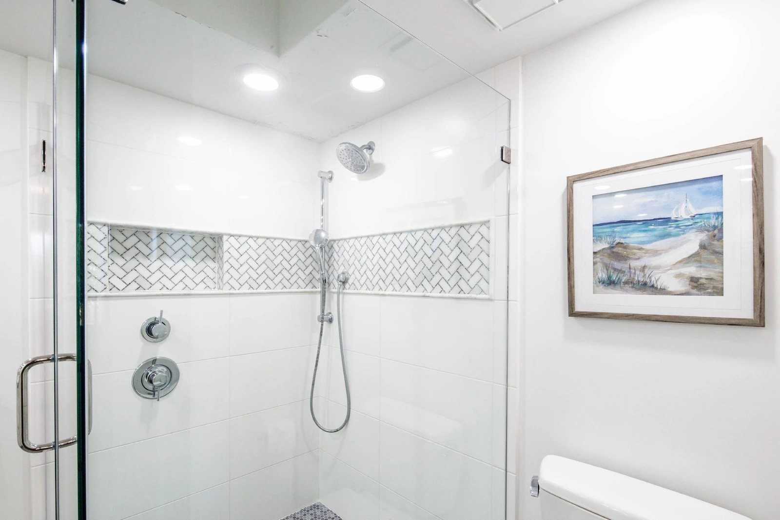 The walk-in shower features two shower heads.