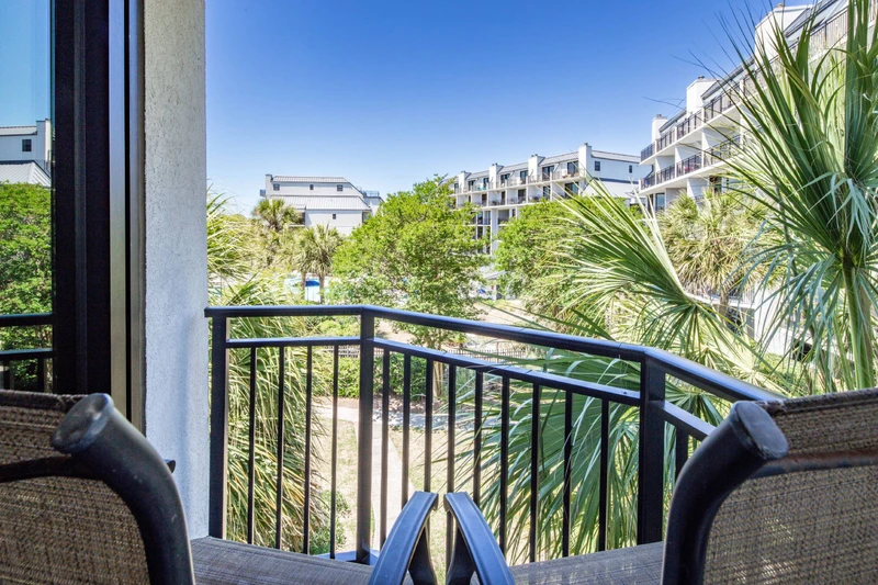 The private balcony off of the king suite looks out over the Shipwatch community pool.