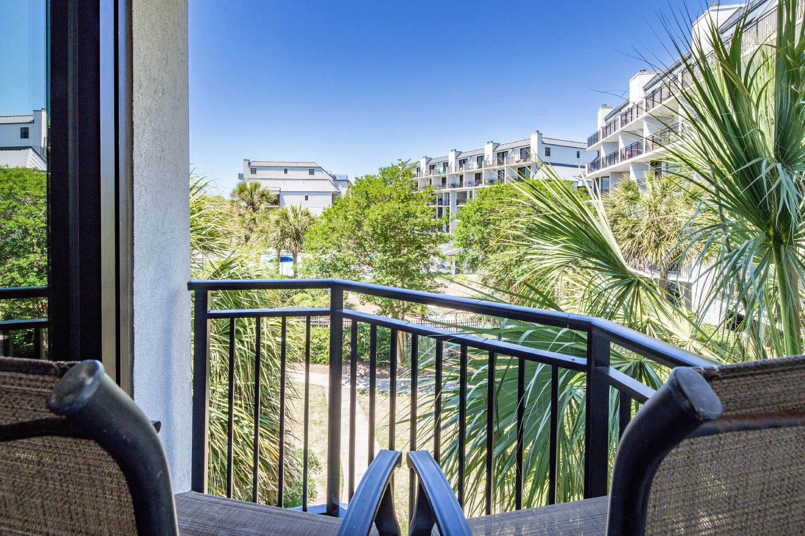 The private balcony off of the king suite looks out over the Shipwatch community pool.