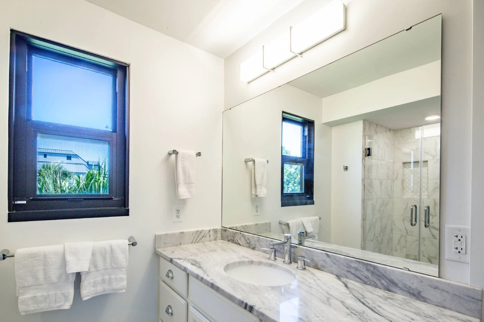 The king en suite bathroom features a spacious vanity.