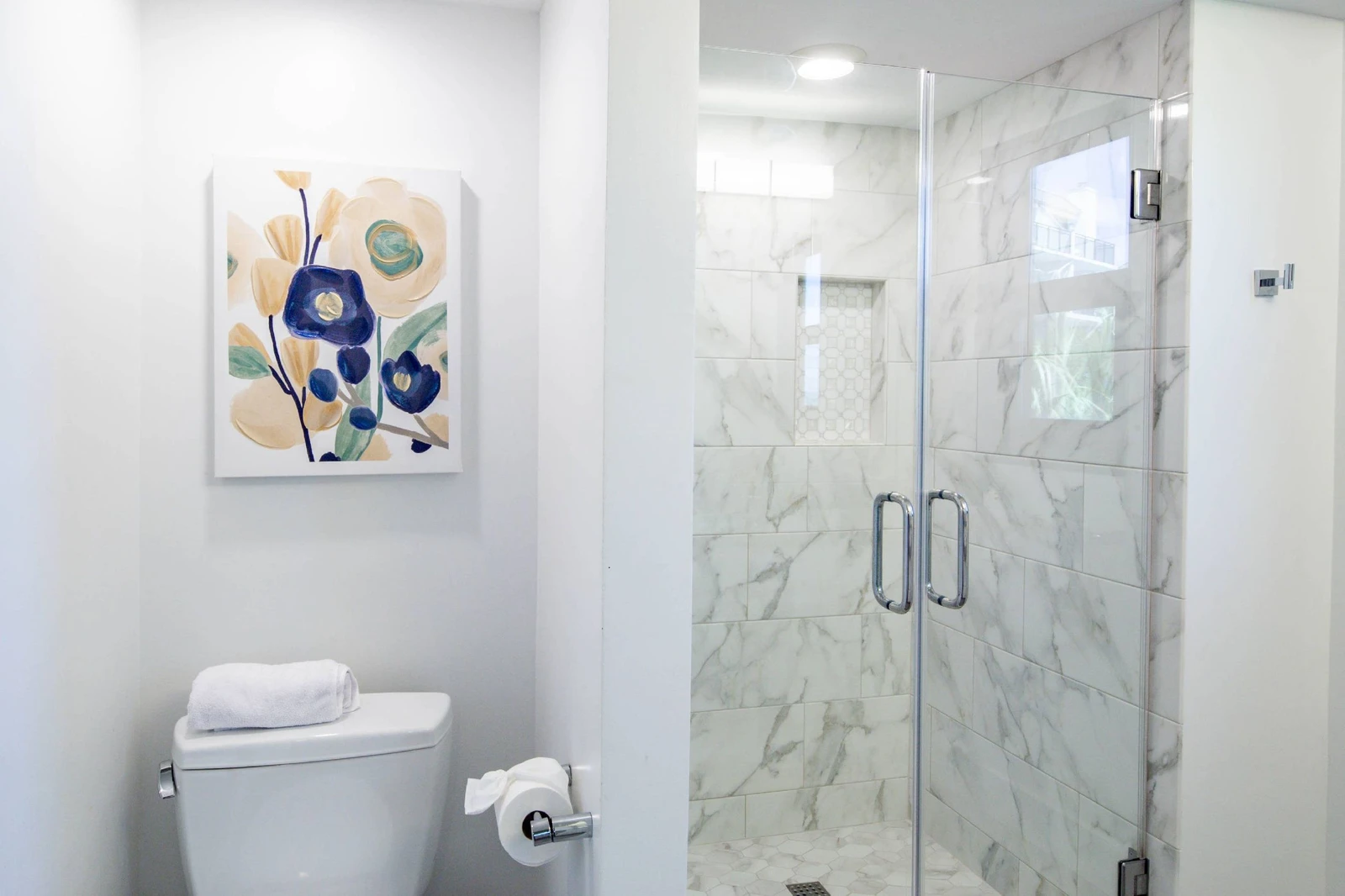 The king en suite bathroom also has a beautifully tiled, walk-in shower.