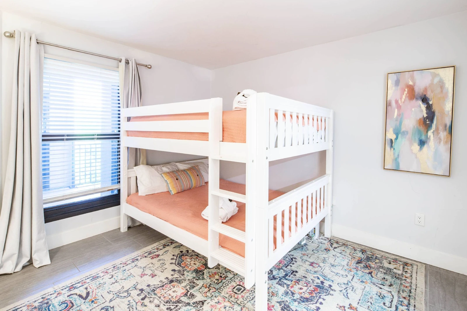 The bunk suite features a queen bed on the bottom bunk and a queen bed on the top bunk.