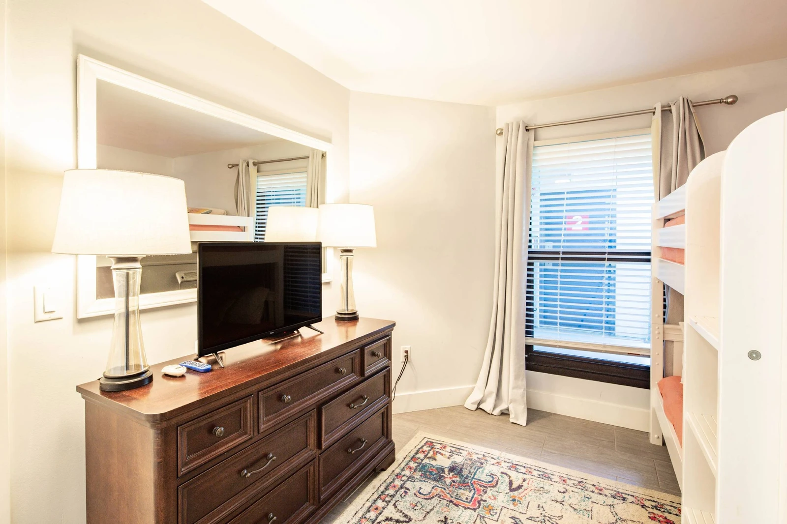 The bunk suite also has a dresser and flat screen smart TV.