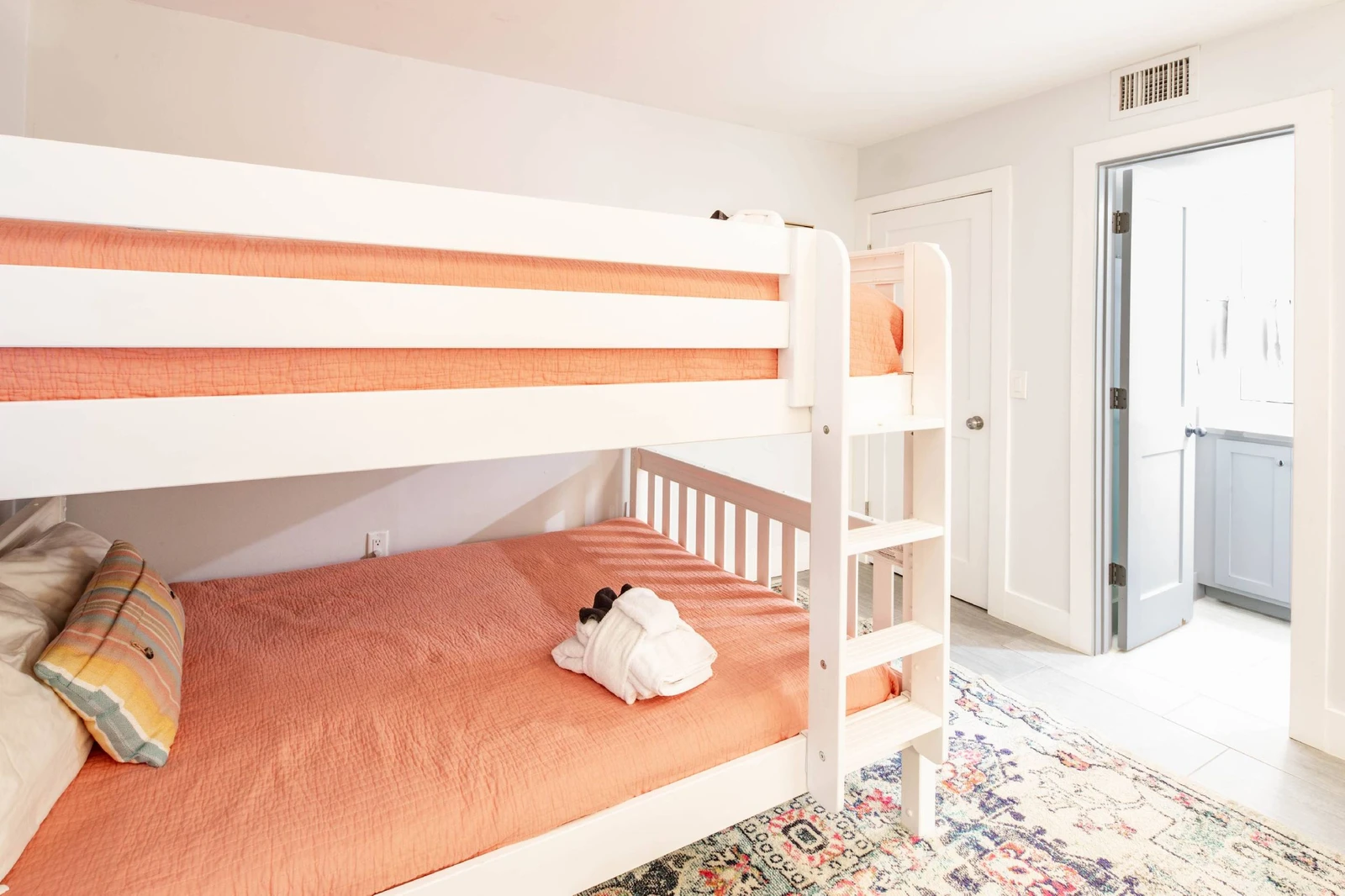 The bunk bedroom also features an en suite bathroom.