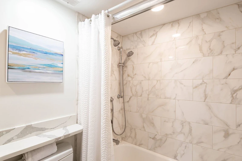 The bunk en suite bathroom also has a shower/tub combo.