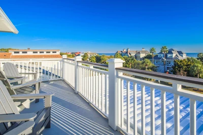 The deck off of the game room on the third floor features ocean views.