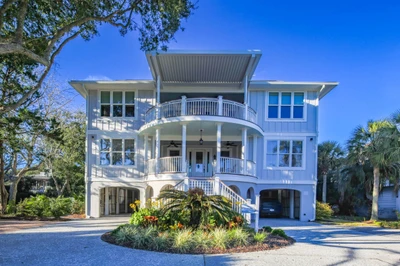 Sea Gem Too is a 3-story home across the street from the Isle of Palms beach.