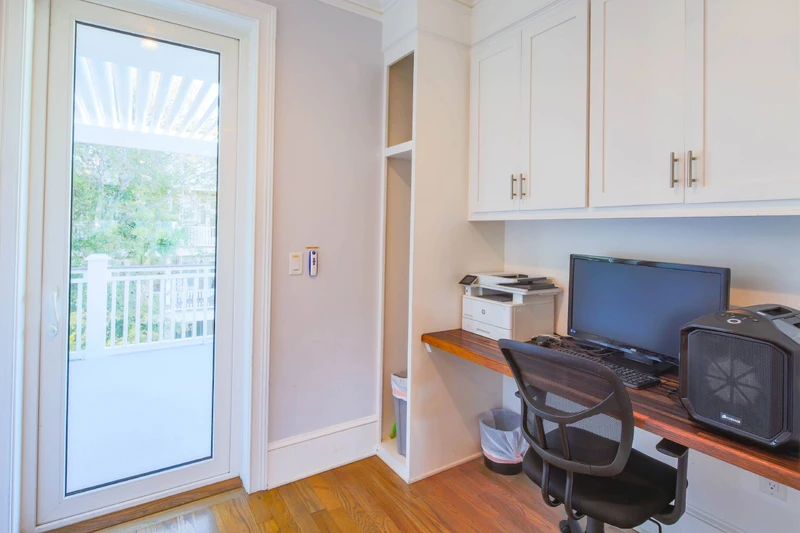There is a desk & workspace near the kitchen.