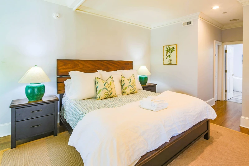 The second level primary suite, which is located off of the living room on the second floor, features a king bed.