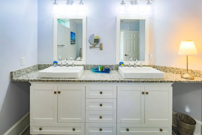 The second level primary en suite bathroom has a spacious, double sink vanity.