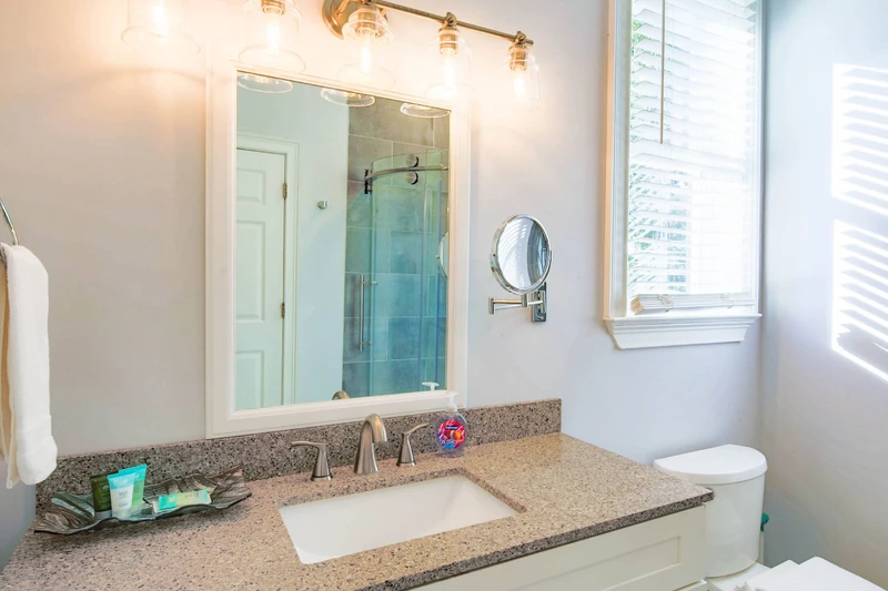 The en suite bathroom has a spacious vanity.