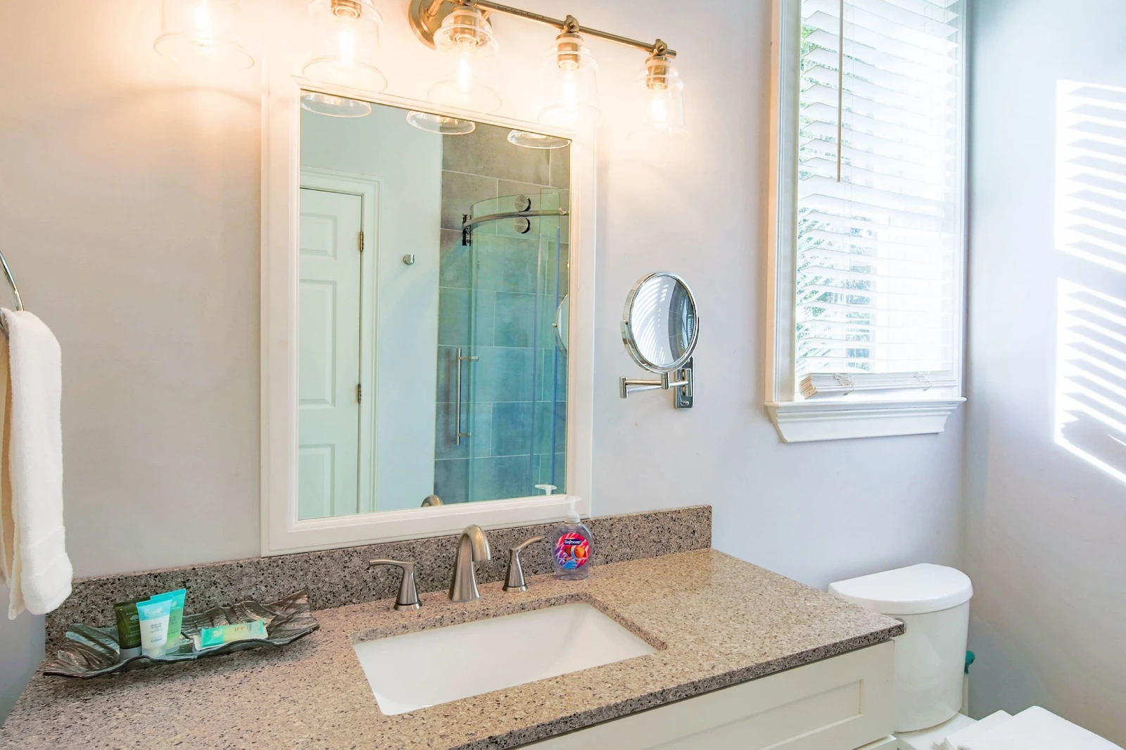 The en suite bathroom has a spacious vanity.