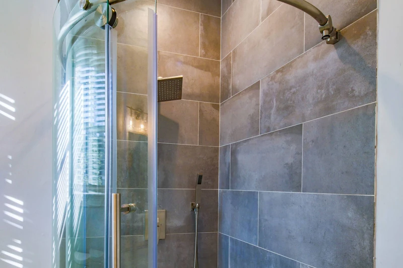 The en suite bathroom also has a tiled, walk-in shower.