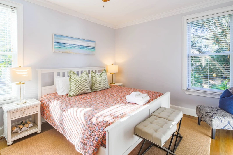 This king suite on the first floor has a king bed and night stands with reading lamps.