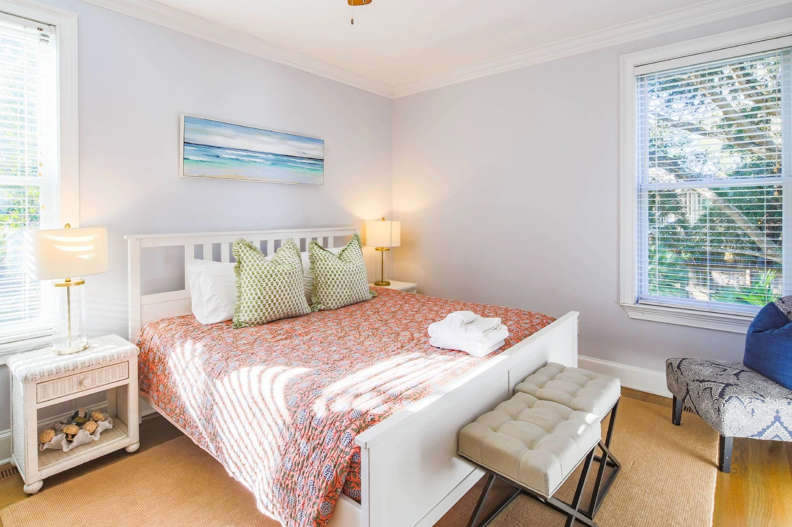 This king suite on the first floor has a king bed and night stands with reading lamps.