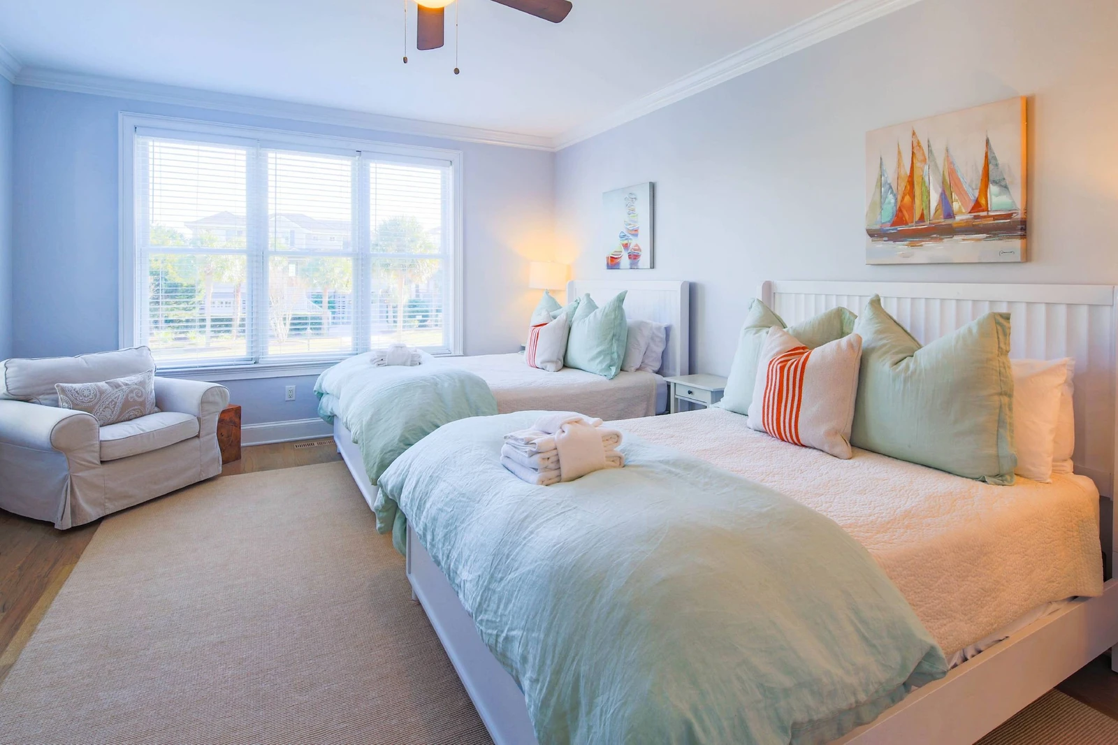 This first floor guest bedroom has two queen beds and access to a Jack & Jill shared bathroom.