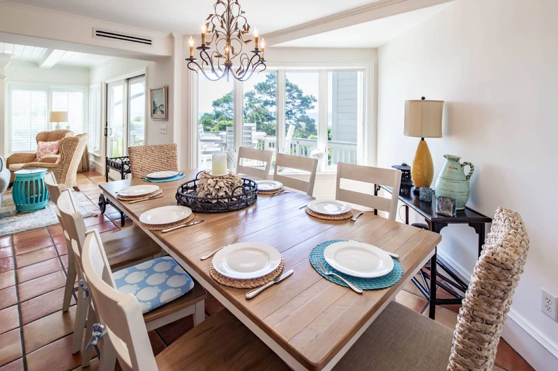 The indoor dining table comfortably seats 8 people.  There are four stools at the kitchen counter.