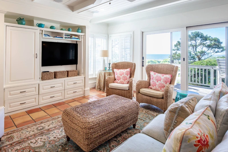 The living room features ocean views and sliding door access to the back deck.
