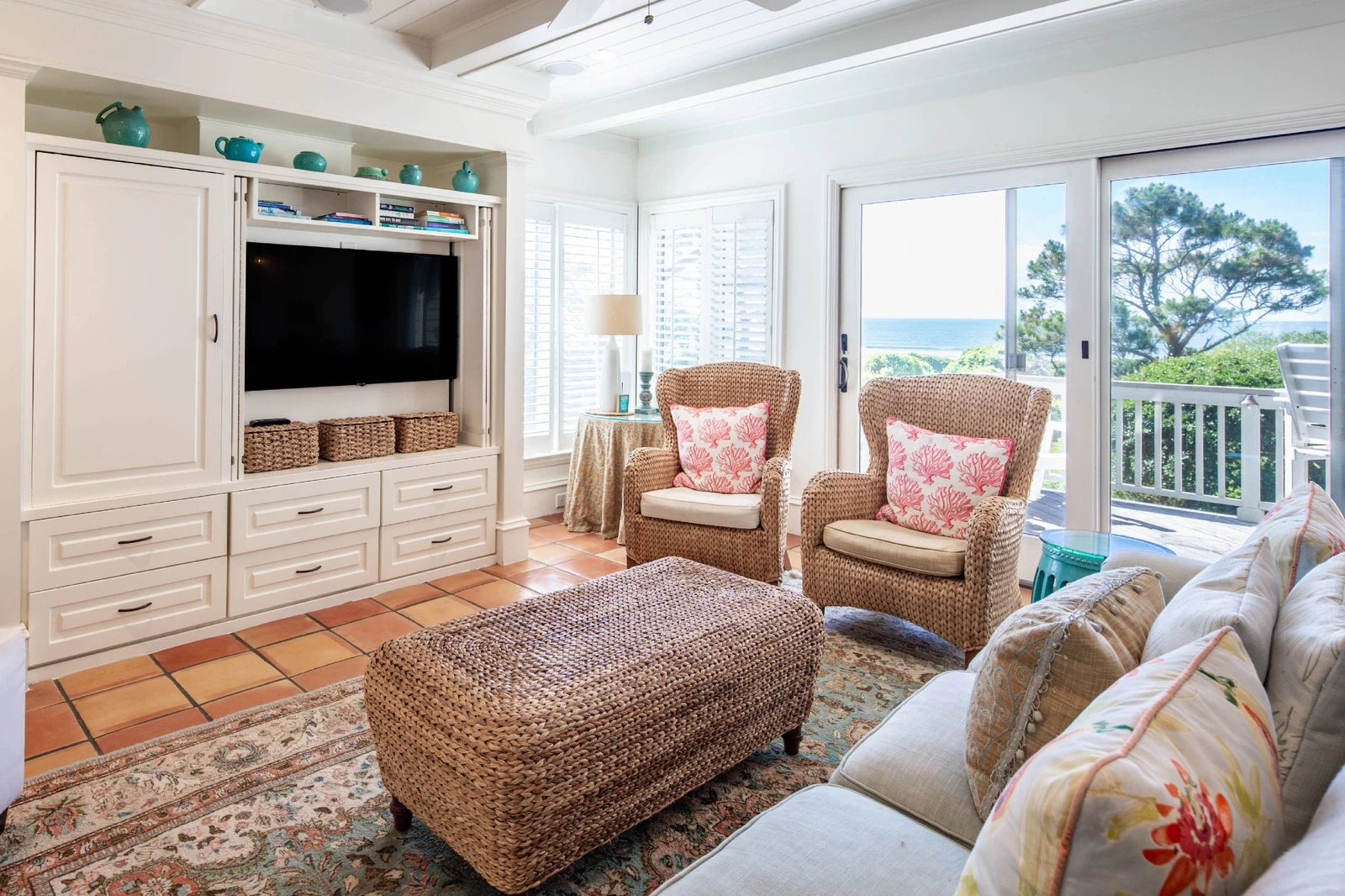 The living room features ocean views and sliding door access to the back deck.
