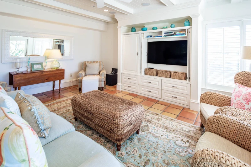 The living room, which is located on the middle level of the villa, features a spaious seating area.