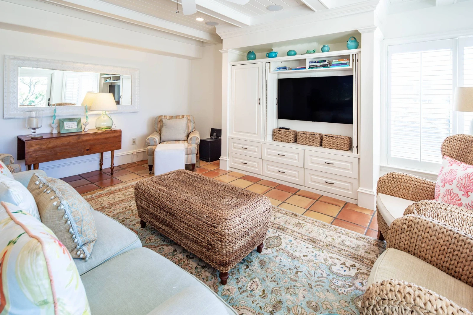 The living room, which is located on the middle level of the villa, features a spaious seating area.