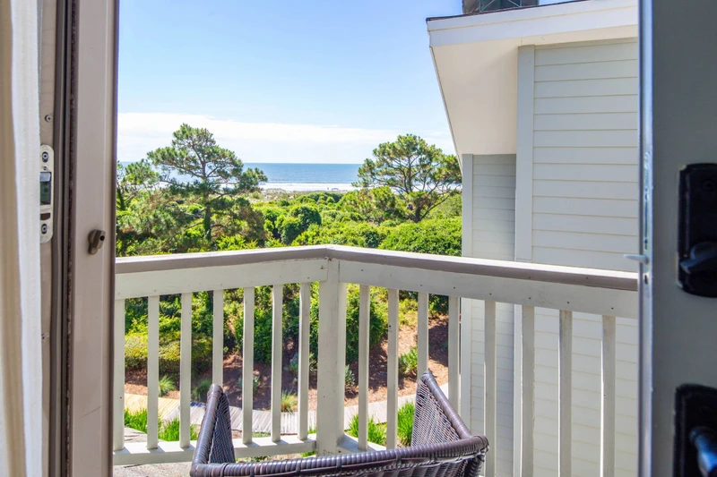 Step out onto the private balcony in the primary suite to enjoy these ocean views.